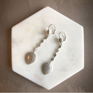 Swirly sun silvertone dangle earrings